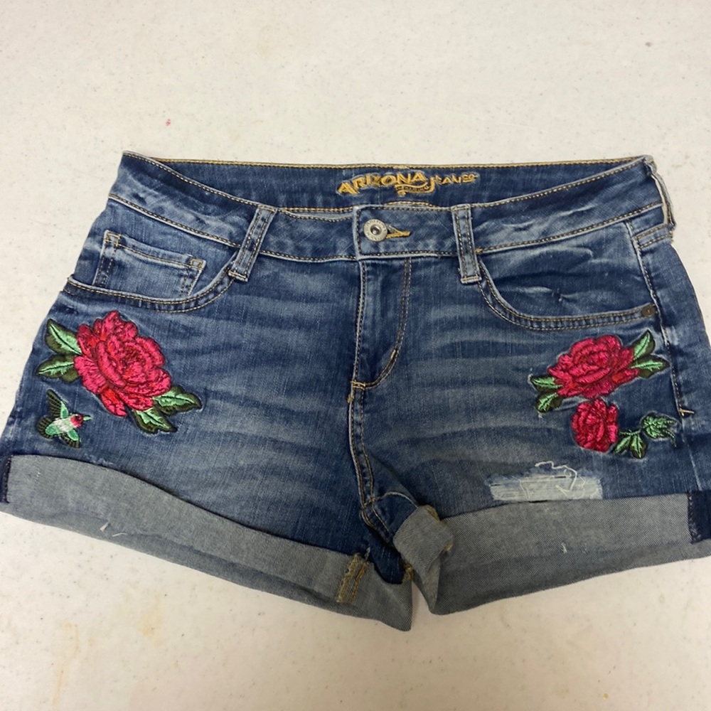 Jean shorts with flowers on it